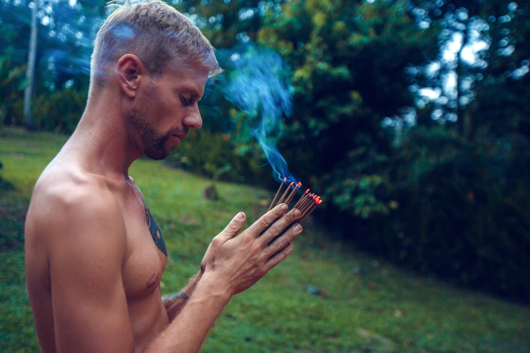 Copal incense purifiction therapy ritual before Mayan Temazcal- traditional steam sauna bath. Shaman performing resin smoke ceremony- clear away all negative energy and make positive changes